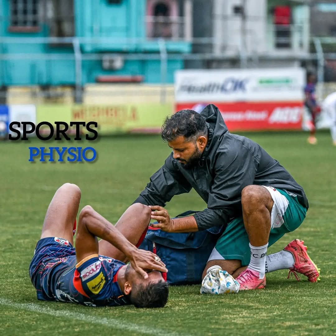 Dr. Vikas Kumar (PT) treating an injured footballer pitch-side during a match